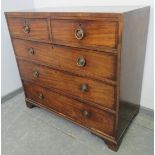 A Regency Period mahogany straight front chest of two short over three long cock-beaded graduated