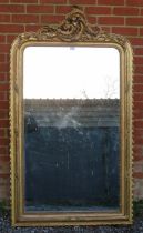 A large 19th century French over mantle mirror, in an ornate gilt gesso frame with beaded edging and