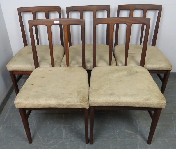 Five mid-century A Younger Volnay dining chairs in afromosia teak, with upholstered seat pads, on