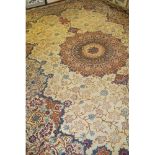 An excellent Persian Meshed carpet, large central motif, set on cream ground 393cm x 272cm. Very
