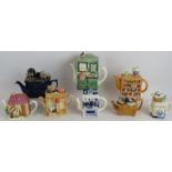 Eight mixed novelty teapots in the form of various kitchen appliances and furniture. Tallest