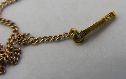 A yellow metal star shaped pendant set with seed pearls on a 15ct yellow gold fine link chain, - Image 2 of 2