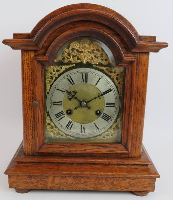 An oak cased mantel clock with striking and chiming German movement marked CB (Badische-Uhrenfabrik)