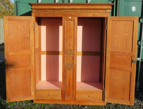 An antique French pitch pine armoire, the double doors with fielded panels, opening onto a hanging - Image 2 of 3