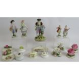 A collection of Dresden and other porcelain including two pairs of figures, a single figure, two