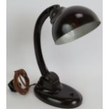 A vintage 1930's Bakelite desk lamp by Eric Kirkham Cole (Ecko Ltd) with adjustable neck and