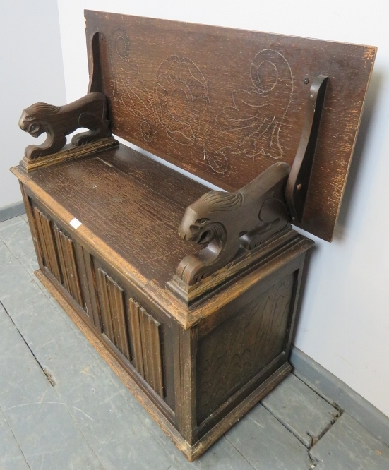 An antique oak monk’s bench, with metamorphic backrest and carved arms in the form of lions, over - Image 2 of 6