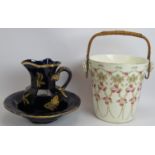 An antique aesthetic movement blue jug and bowl set with gilt butterfly and insect decoration and an