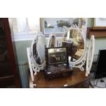 A trio of dressing table mirrors to include two Marie Antoinette framed oval triple plates, the