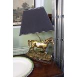 A TABLE LAMP IN THE FORM OF A GILDED MODEL HORSE