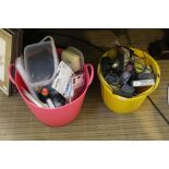 Two plastic receptacles containing a selection of DIY and domestic items, various