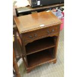 A REPRODUCTION MAHOGANY FINISHED SIDE UNIT with single drawer over adjustable shelved recess