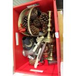 A red crate containing a selection of mainly domestic metal wears to include copper kettle, brass
