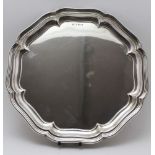 Williams Adams Ltd. A Georgian design silver salver with piecrust rim, raised on four button feet,