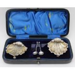 A pair of late Victorian silver salts of scallop shell form, gilded interiors, together with two