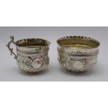 Wakeley & Wheeler, a late Victorian silver cream jug & sugar bowl, embossed decoration, gilded