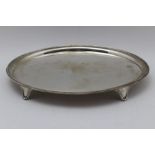 A George III oval silver salver, with reeded rim raised on four scroll supports, London 1800, 30.5cm