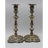 William Hutton Ltd. A pair of Edwardian silver candlesticks of Georgian design, each having