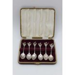 A set of six early 20th century silver coffee spoons, with cast thistle terminals, Birmingham