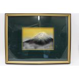 A late 20th century Japanese embossed metal panel depicts Mount Fuji, various seal marks &