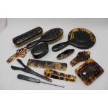 Circa 1920s, five piece ladies dressing set, having tortoiseshell carcasses with carved and