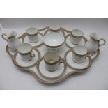 A Worcester ceramic coffee set, comprising; shaped tray with six cans & saucers, sugar bowl, and a