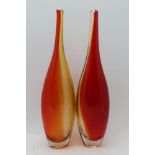 A pair of mid-20th century Art glass bottle vases of slender form in red & amber, 40.5cm high (2)