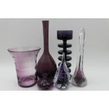 A collection of amethyst tinted glass wares, includes a flared rim celery vase 14cm high, a