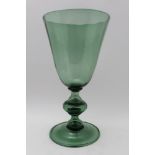 A 20th century Italian green tinted glass goblet, tapering bowl on knop stem, with circular domed