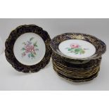 A porcelain dessert set in the Coalport style, comprising ten plates 22.5cm in diameter, and a low