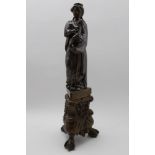 An 18th century European cast bronze Madonna and child on a Rococo triform base, with ball & claw