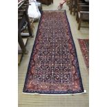 A woven woollen dark blue ground Mahal runner, 394cm x 112cm