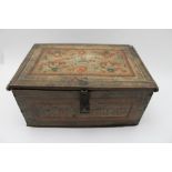 An early to mid-19th century painted wood table casket, hinged cover with iron latch, decorated with