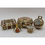 A collection of Royal Crown Derby porcelain items in the Imari palette, to include; an oval lidded