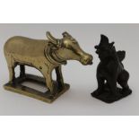 Two Sino-Tibetan cast bronze animals, possibly 18th century, to include a polished standing bull,