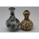 Two Chinese onion form vases, one painted in the famille rose palette with figurative panels, 12cm