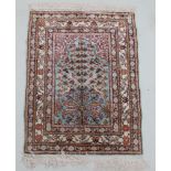 A recently manufactured 17th-century design silk prayer rug, approx 45cm x 60cm, with certificate of