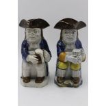 Two 19th century Pratt ware ceramic Toby jugs, modelled as seated figures in 18th century costume