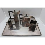 A modernist style silver plated tea set, c.1900, of cubist form, in the Christopher Dresser style,