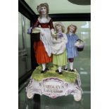 A porcelain figural group, the base advertising Yardley's old English lavender