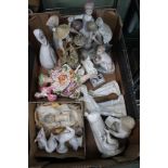 A box containing a selection of porcelain figurines to include Spanish examples