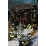 A box containing a selection of domestic brass and copper wears to include candlesticks