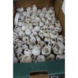 A box containing an extensive collection of Goss crested China wares