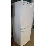 A Miele branded freestanding white fridge freezer