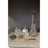 A selection of silver necked glass-based scent bottles, together with a silver Vesta and other