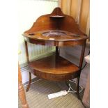 A Georgian mahogany corner washstand of typical form construction