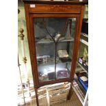 An inlaid mahogany glazed display case, with bar glazed single door opening to reveal shelved