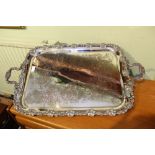 A large silverplated twin handled tray, with grain and vine cast borders