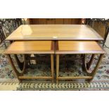 A red label G plan Teak finished nest of tables having large rectangular top and two square topped