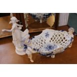 A Wedgwood dancing hours figurine, together with a blue-and-white decorated pierced basket held